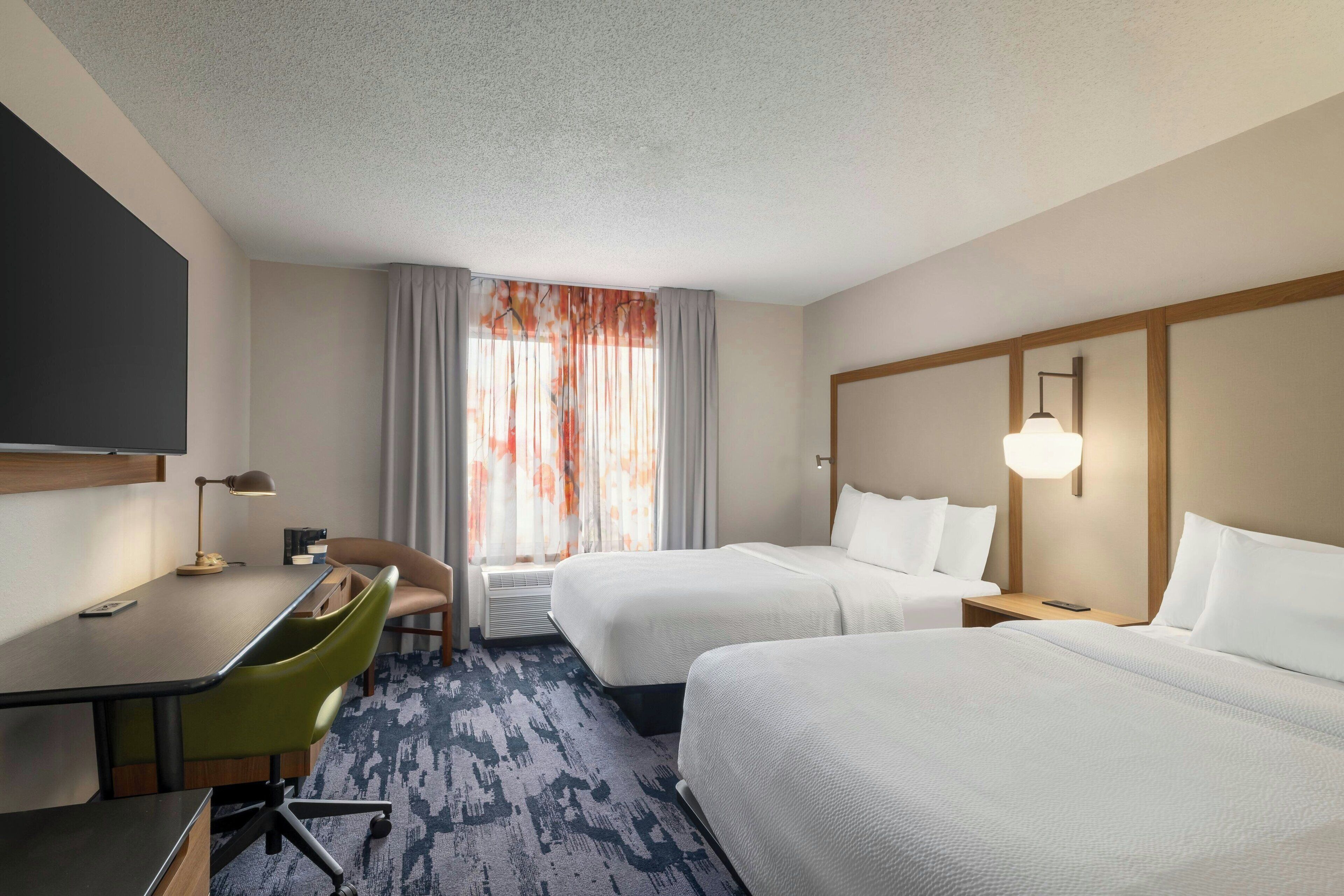 Premium bedding, desk, laptop workspace, iron/ironing board