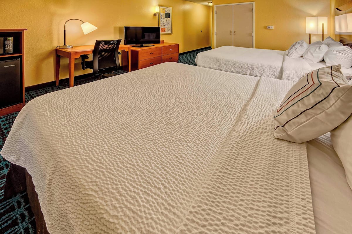 Premium bedding, desk, laptop workspace, iron/ironing board