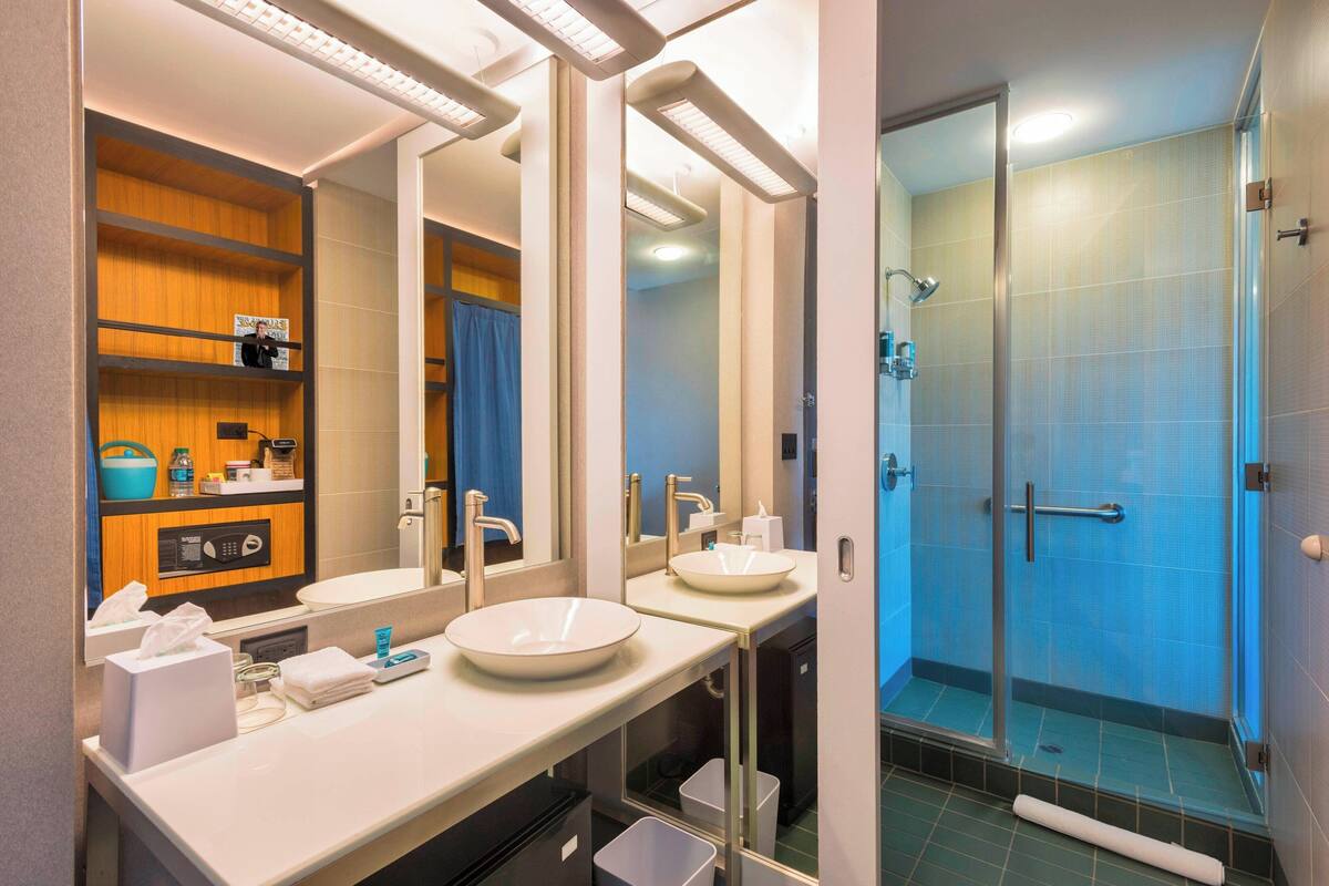 room, 1 king bed | bathroom | designer toiletries, hair dryer, towels, soap