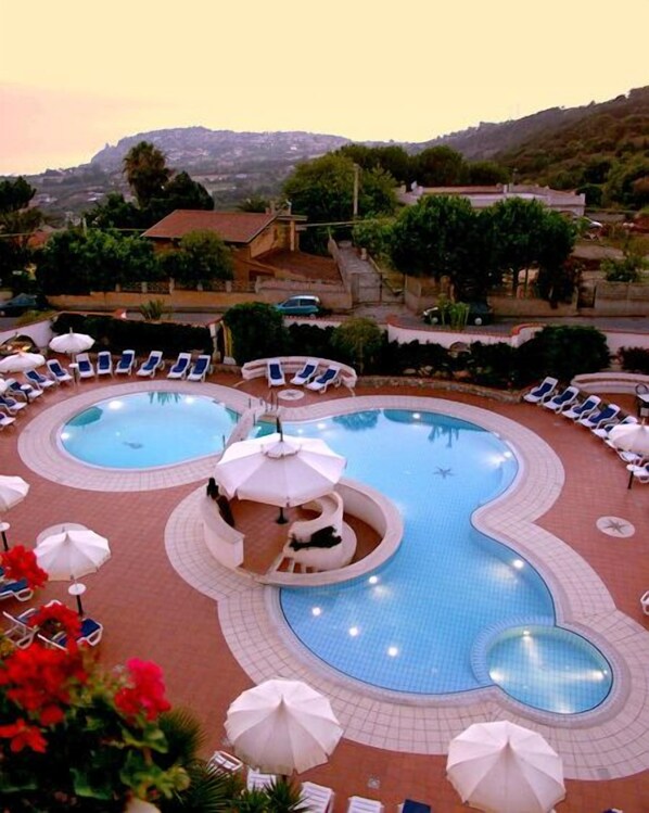 Outdoor pool, open 8:00 AM to 8:30 PM, pool umbrellas, pool loungers