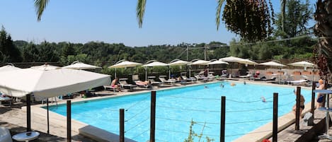 Seasonal outdoor pool, pool umbrellas, sun loungers