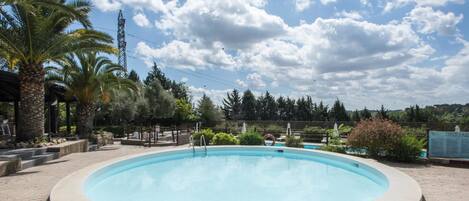 Seasonal outdoor pool, pool umbrellas, pool loungers