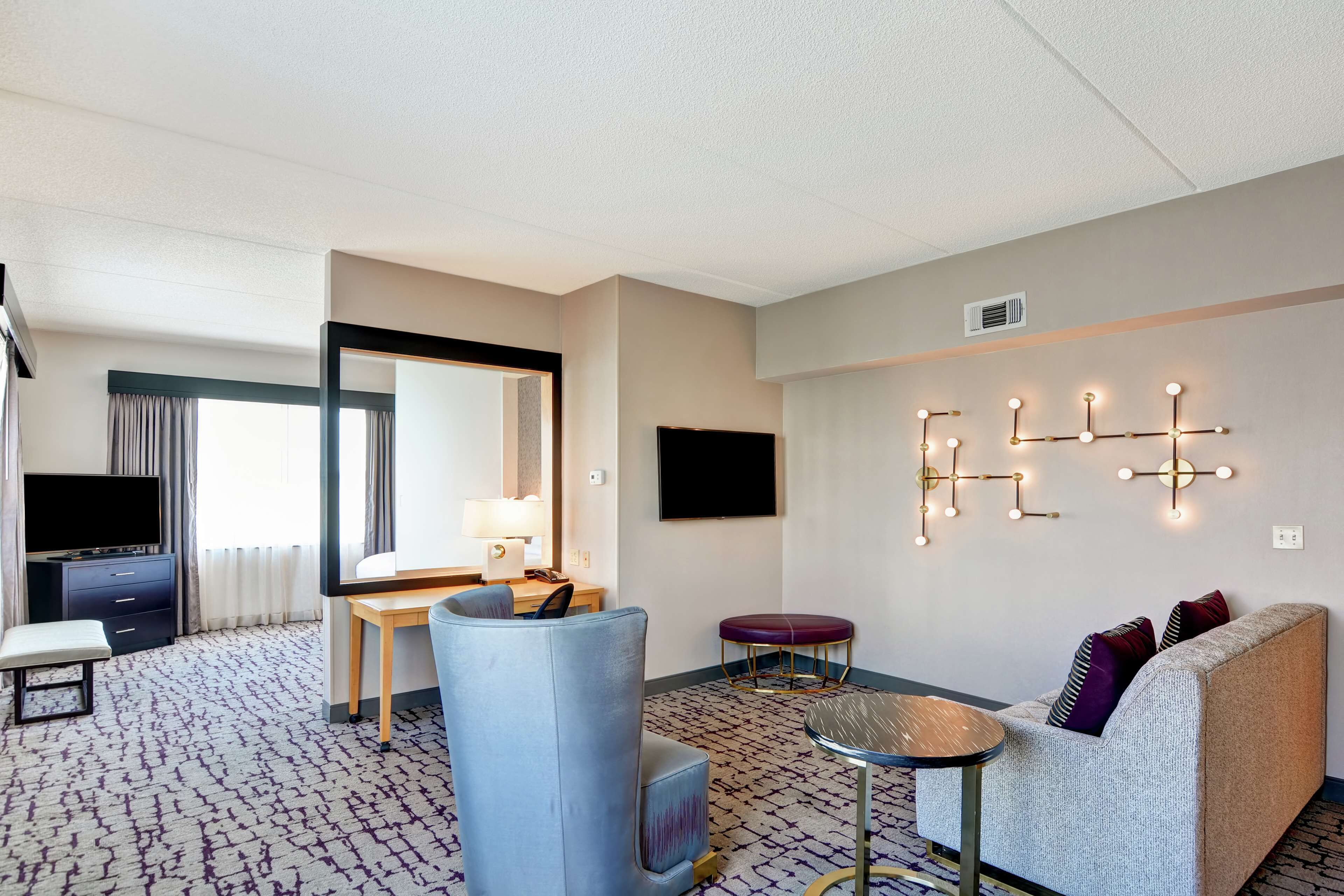 room, 1 king bed with sofa bed (larger room) | living area | lcd tv, mp3 dock