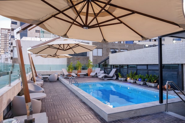 Outdoor pool, pool umbrellas, pool loungers