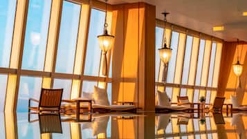Indoor pool, open 7:30 AM to 10:00 PM, pool loungers, lifeguards on site