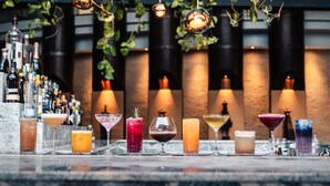 A bar with various cocktails and bottles of liquor. - Tribe Hotel (Nairobi)