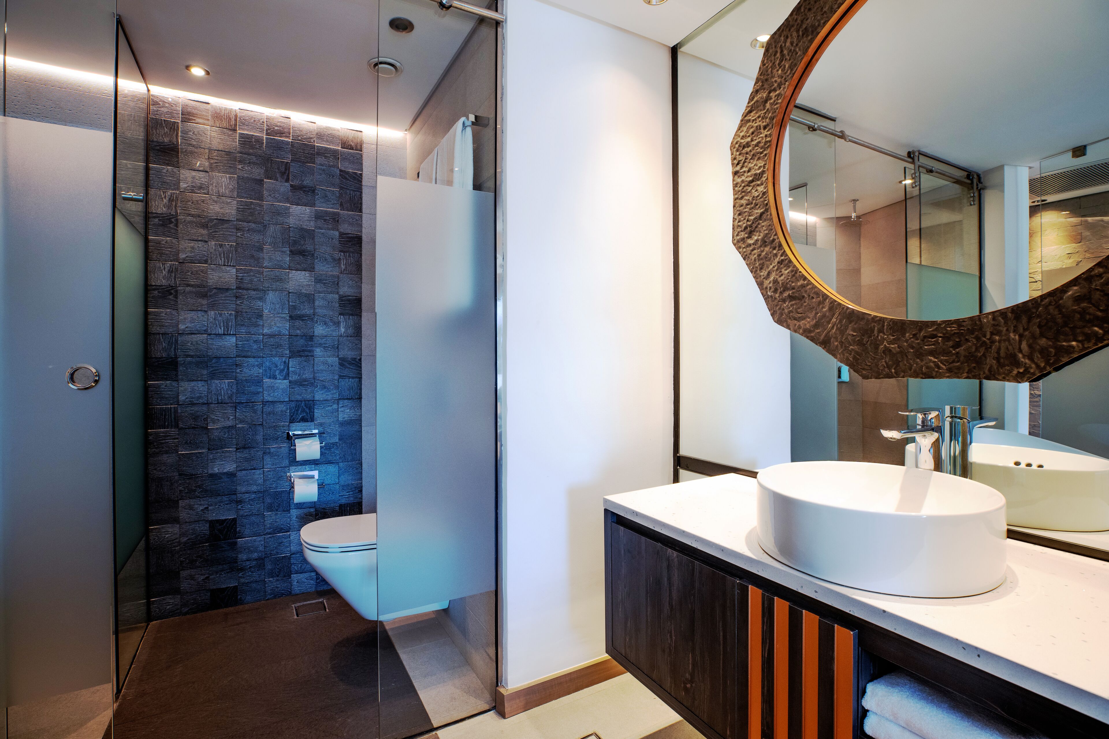 separate bathtub and shower, rainfall showerhead, designer toiletries