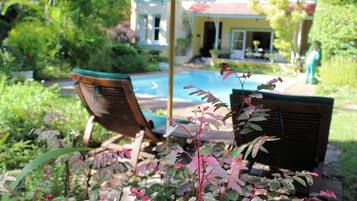 Outdoor pool, open 7:00 AM to 6:00 PM, pool umbrellas, pool loungers