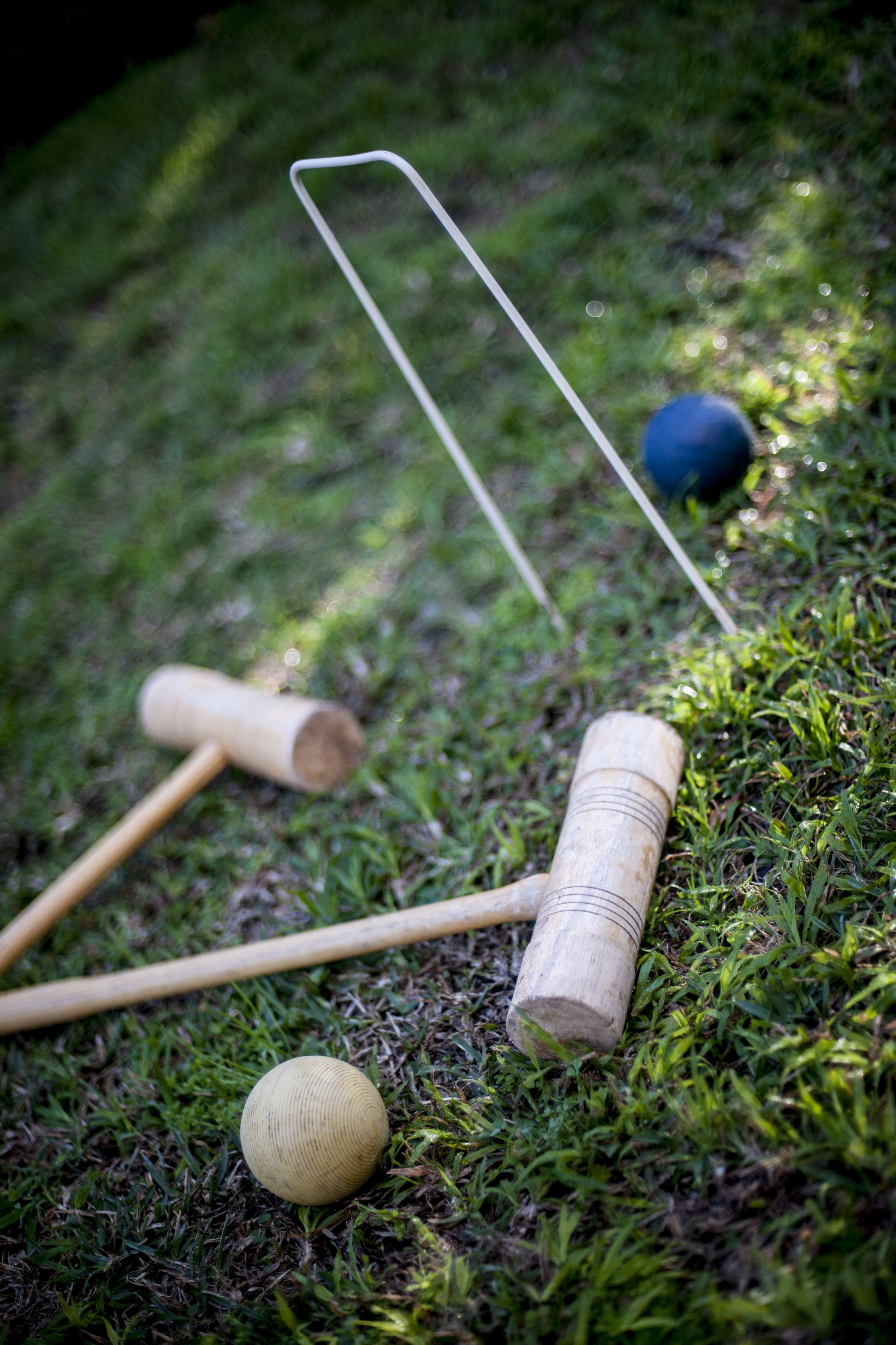 A croquet set on a grassy lawn.
