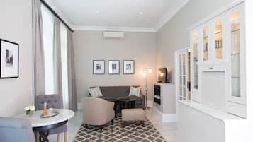 Junior Suite (Garden) | Living area | 32-inch LED TV with cable channels, TV