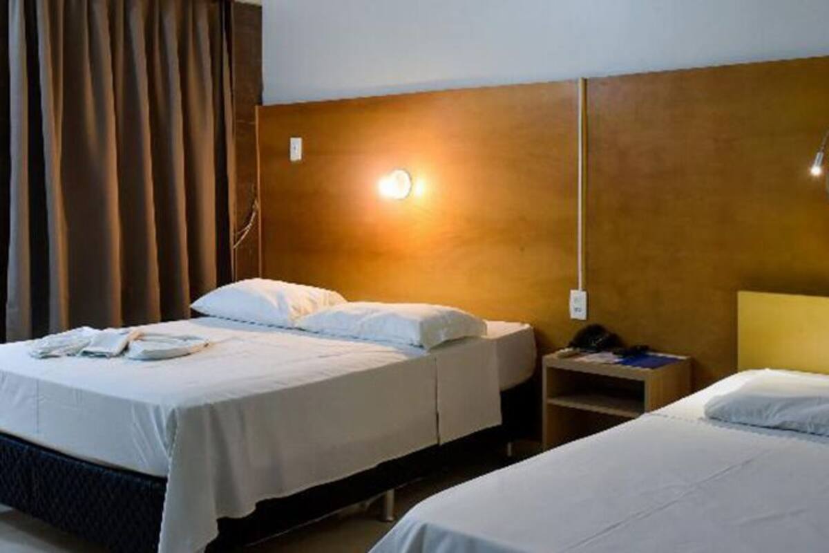 economy double or twin room | pillow-top beds, minibar, in-room safe, individually decorated
