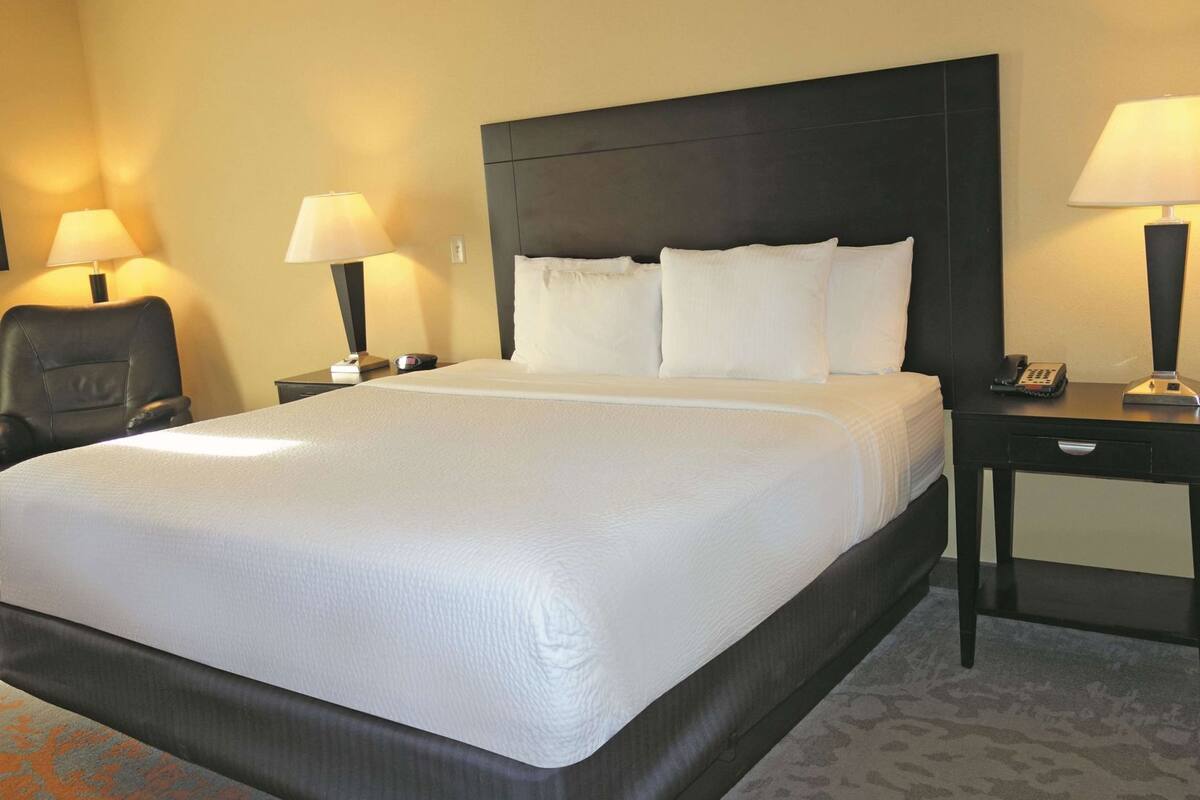 Premium bedding, desk, blackout curtains, iron/ironing board