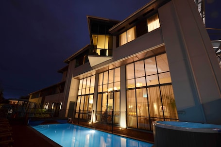 Outdoor pool, open 7:00 AM to 10:00 PM, pool loungers