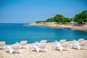 Beach nearby, white sand, beach umbrellas, beach bar