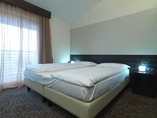 Down duvets, memory-foam beds, in-room safe, desk