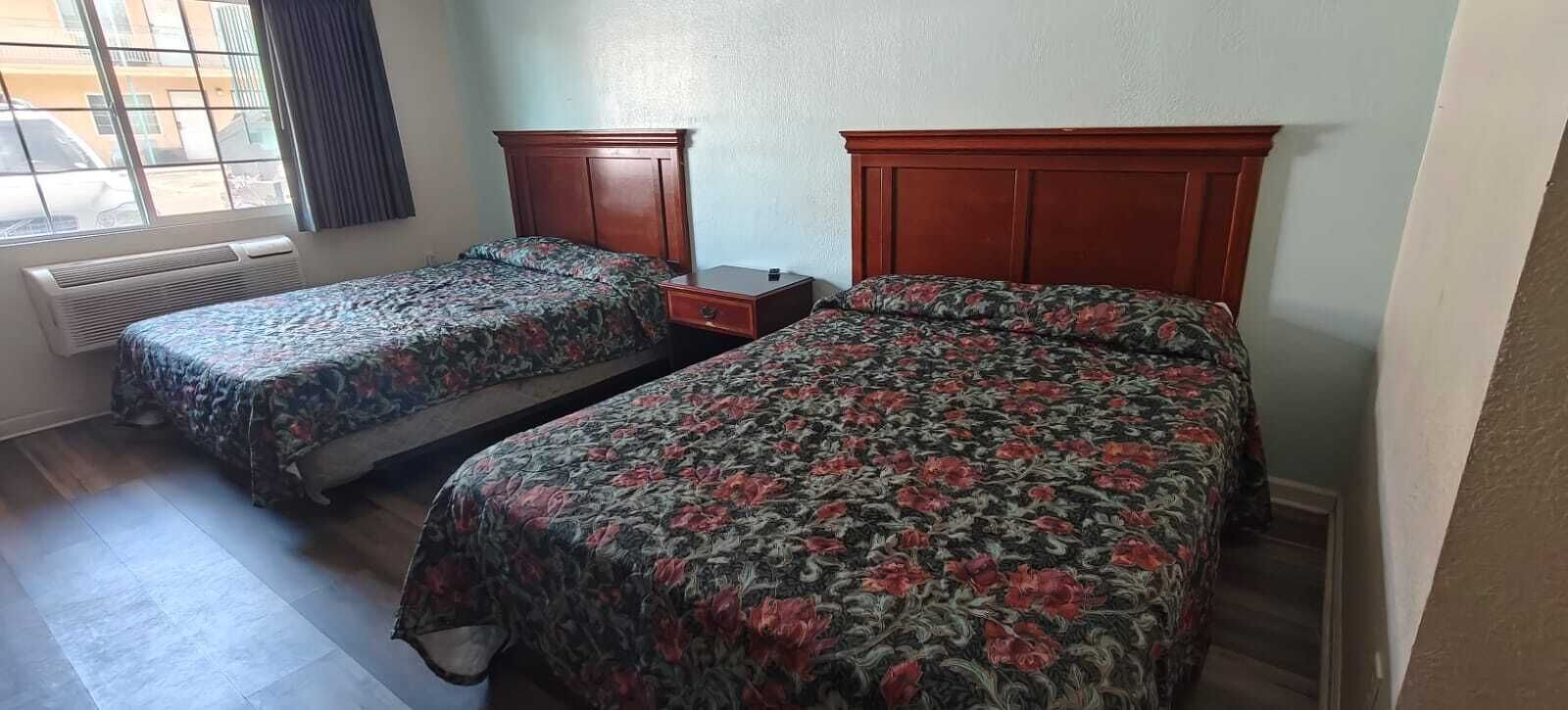 Room, 2 Queen Beds, Non Smoking | Desk, iron/ironing board, free WiFi, bed sheets