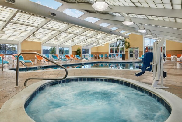 Indoor pool, open 10:00 AM to 10:00 PM, pool loungers