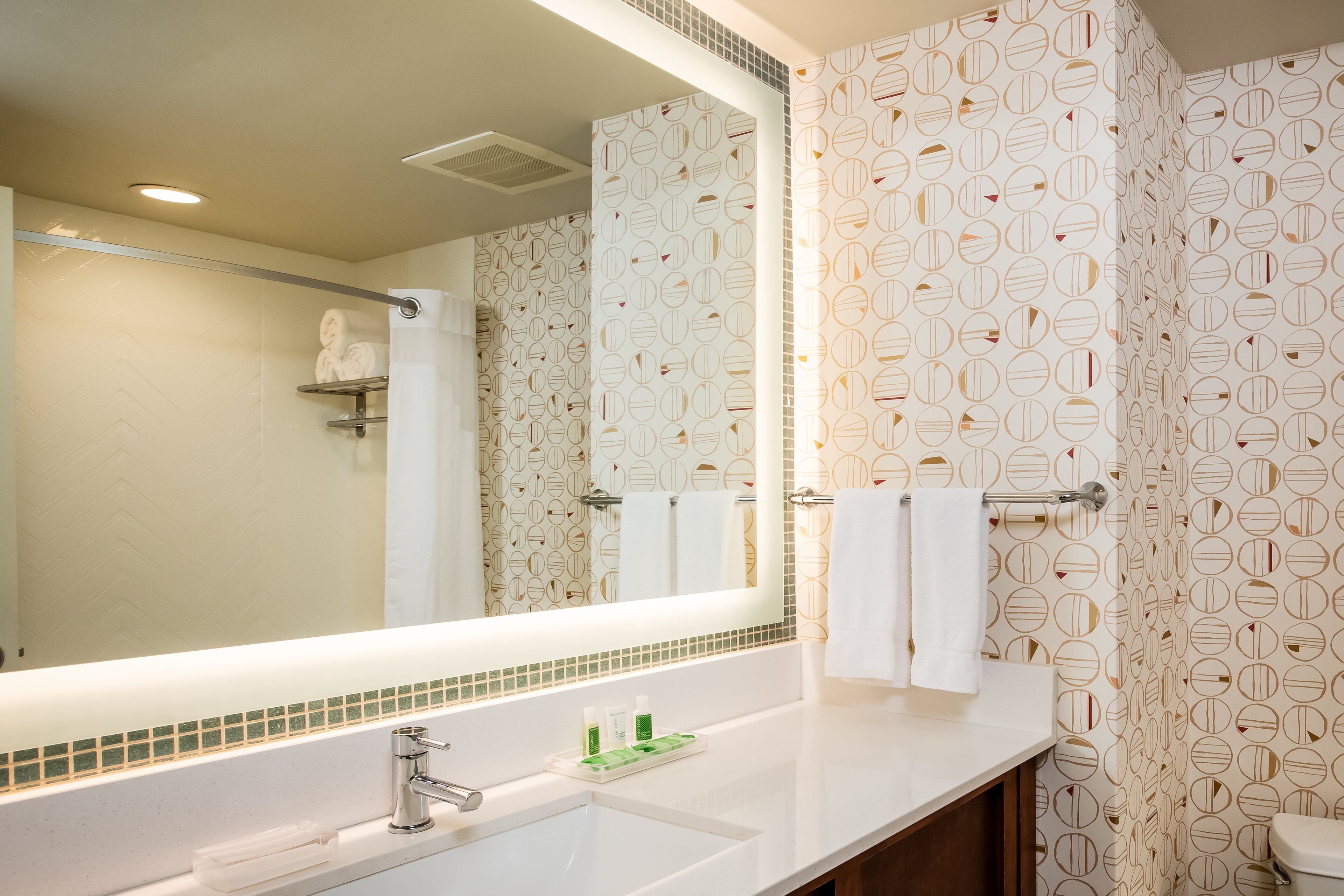 deep-soaking bathtub, rainfall showerhead, free toiletries, hair dryer