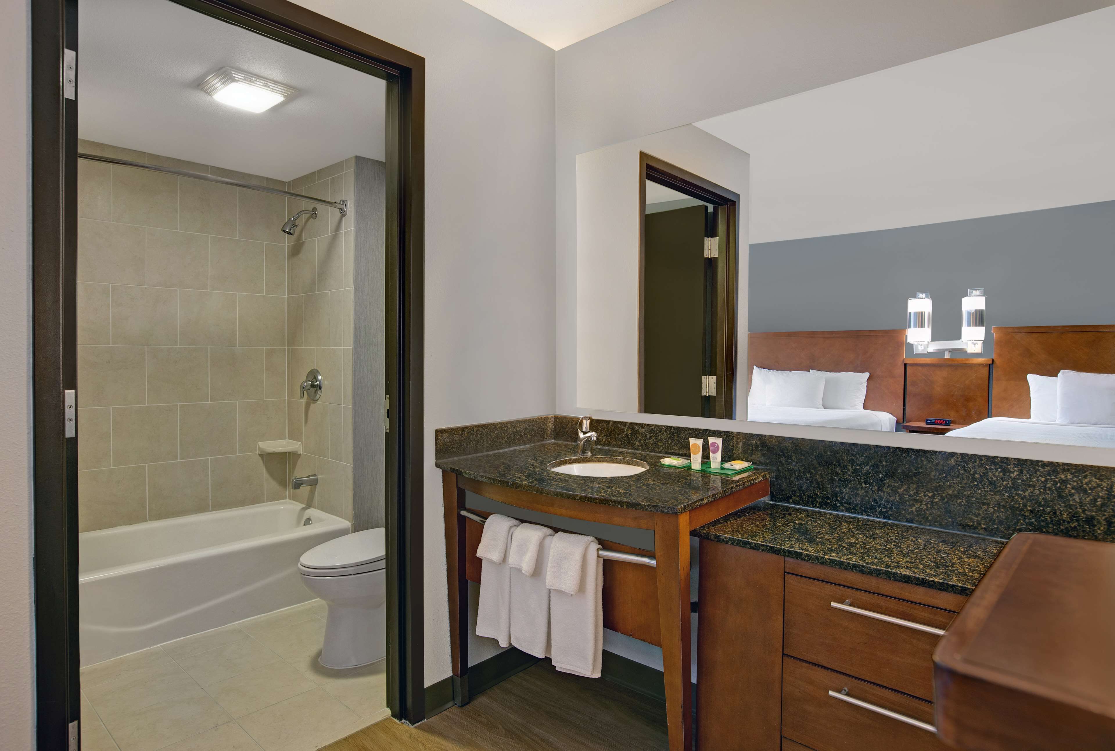 designer toiletries, hair dryer, towels