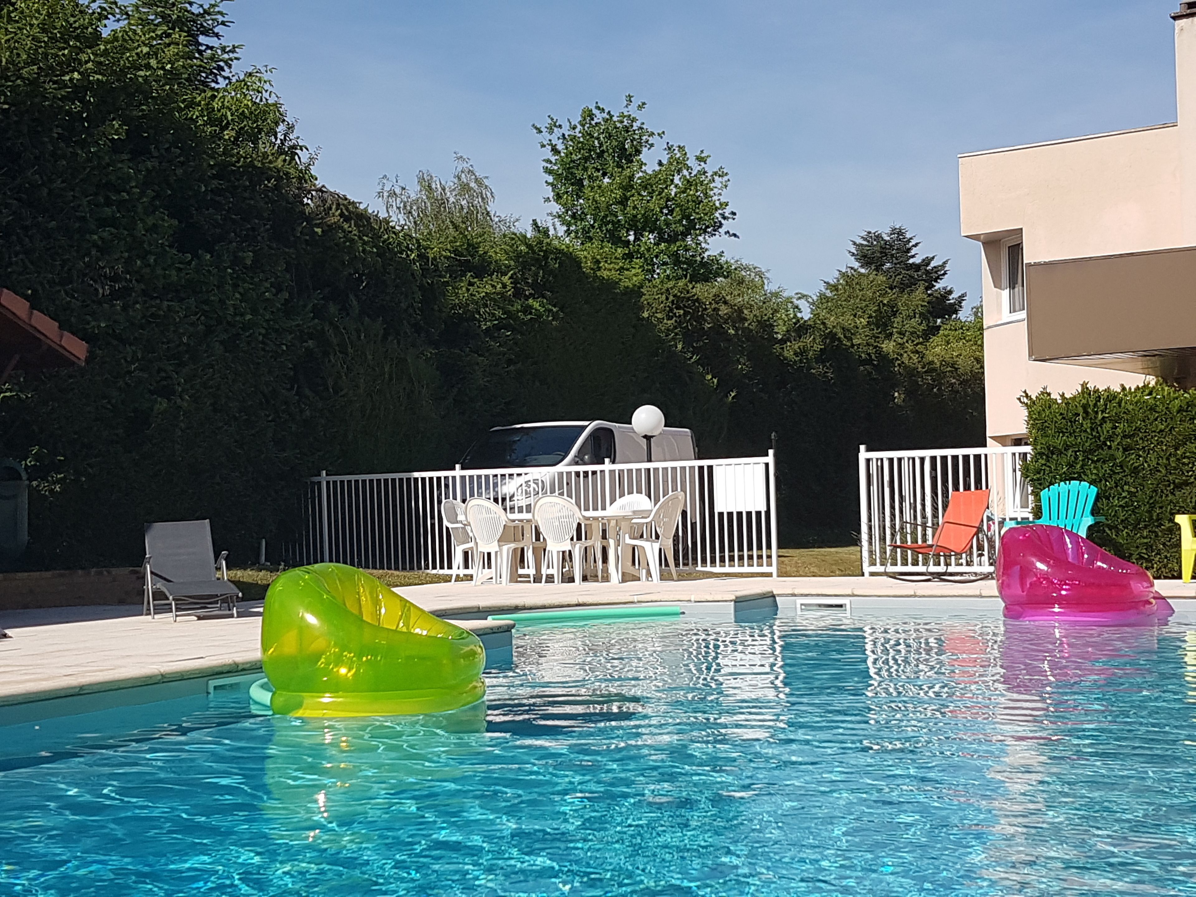 seasonal outdoor pool, pool umbrellas, pool loungers