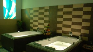 A bathroom with two separate tubs, checkered tile walls, and a fruit display. - EA Hotel Downtown (Prague)