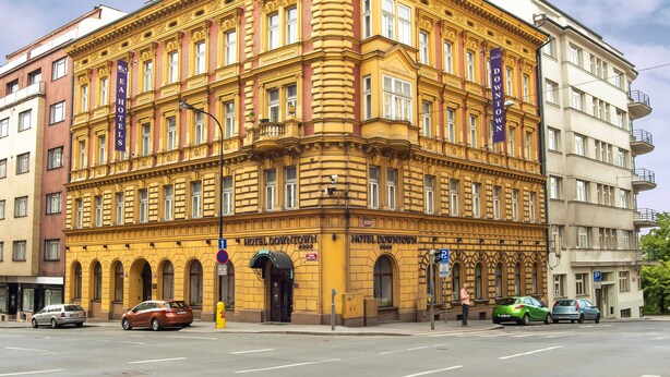 A historic hotel building with a classic architectural style, featuring multiple windows and a prominent entrance. - EA Hotel Downtown (Prague)