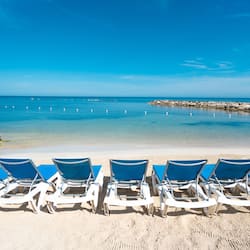 Private beach, white sand, sun loungers, beach umbrellas