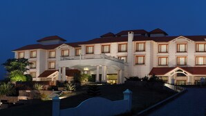 A large, multi-story hotel with a grand entrance, a covered walkway, and a landscaped driveway. - Fortune Park Panchwati, Kolkata - Member ITC Hotels' Group (Howrah)