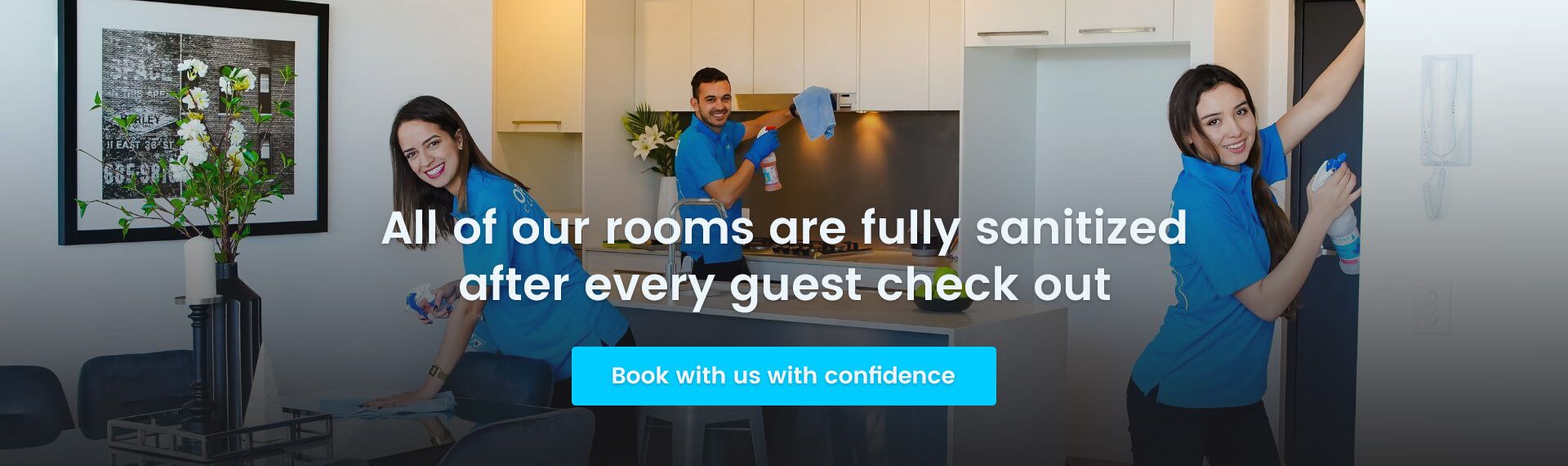 A hotel room with a modern kitchen, a dining area, and a living space. The room is well-lit with natural light.