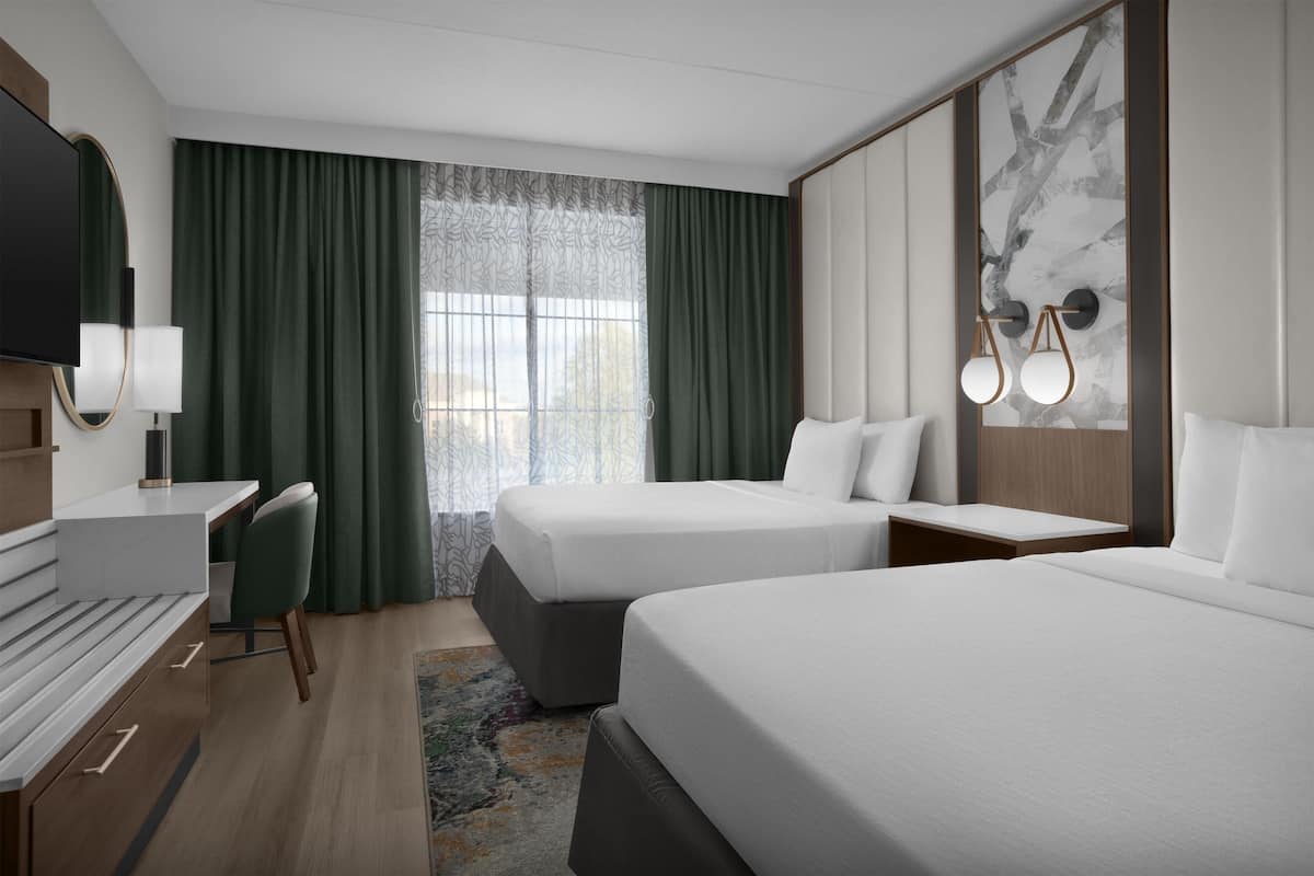 Ropa de cama de alta calidad y caja de seguridad en la habitación