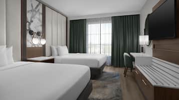 Ropa de cama de alta calidad y caja de seguridad en la habitación