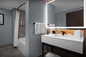 Combined shower/bathtub, designer toiletries, hair dryer, towels