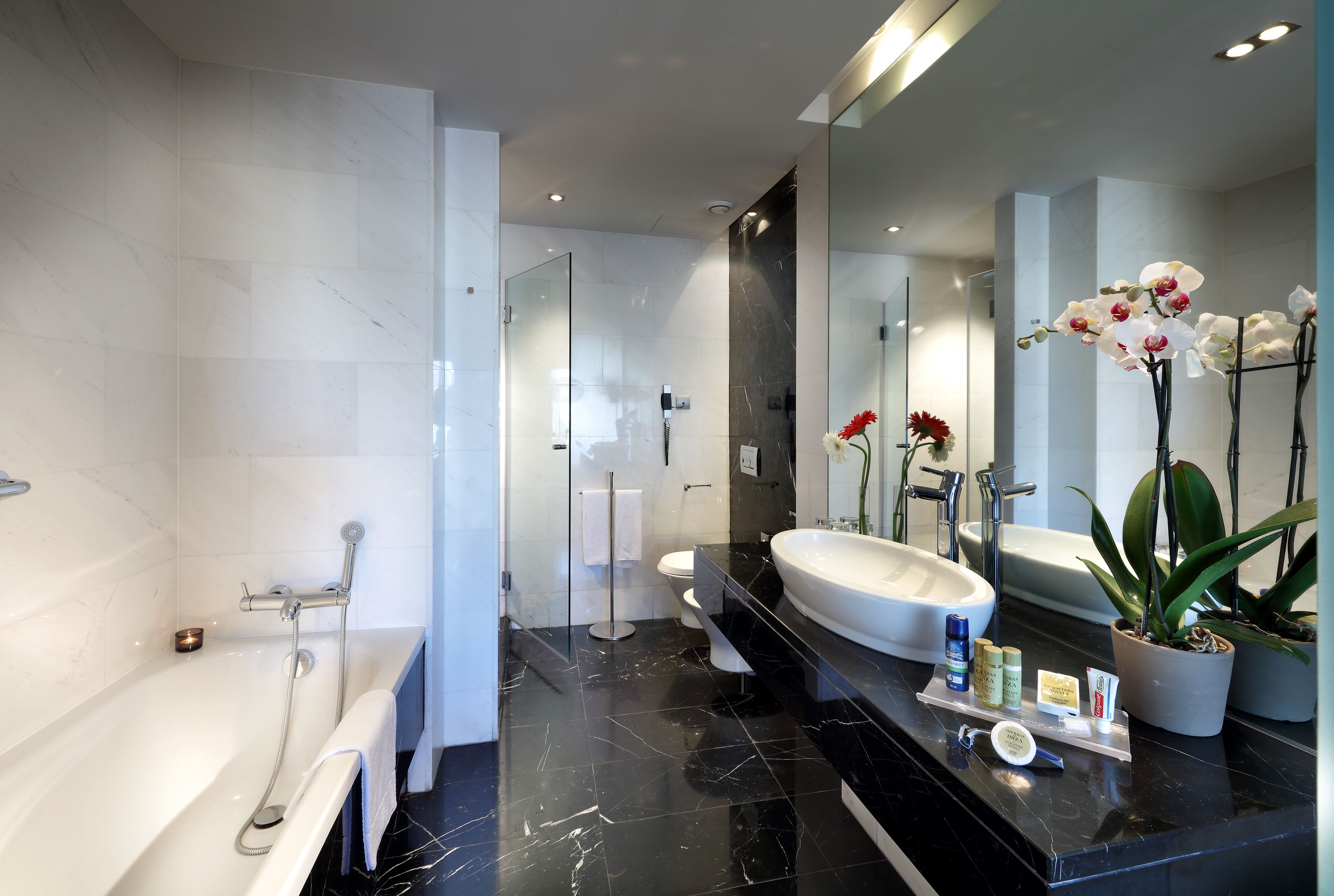 junior suite, 1 king bed with sofa bed | bathroom | combined shower/bathtub, rainfall showerhead, eco-friendly toiletries