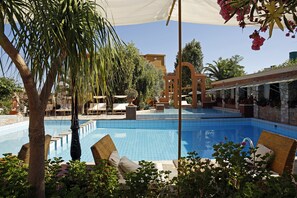 2 outdoor pools, open 10:30 AM to 6:30 PM, pool umbrellas, pool loungers