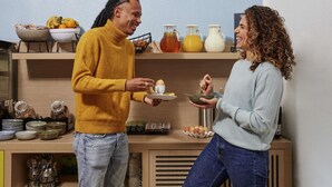 A kitchen with a breakfast setup including eggs, fruits, and beverages. - Aparthotel Adagio Access Paris Quai D'Ivry (Ivry-sur-Seine)
