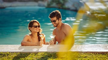 Outdoor pool, open 10:00 AM to 10:00 PM, pool umbrellas, pool loungers