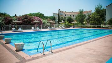 Outdoor pool, open 9:00 AM to 7:00 PM, pool umbrellas, sun loungers