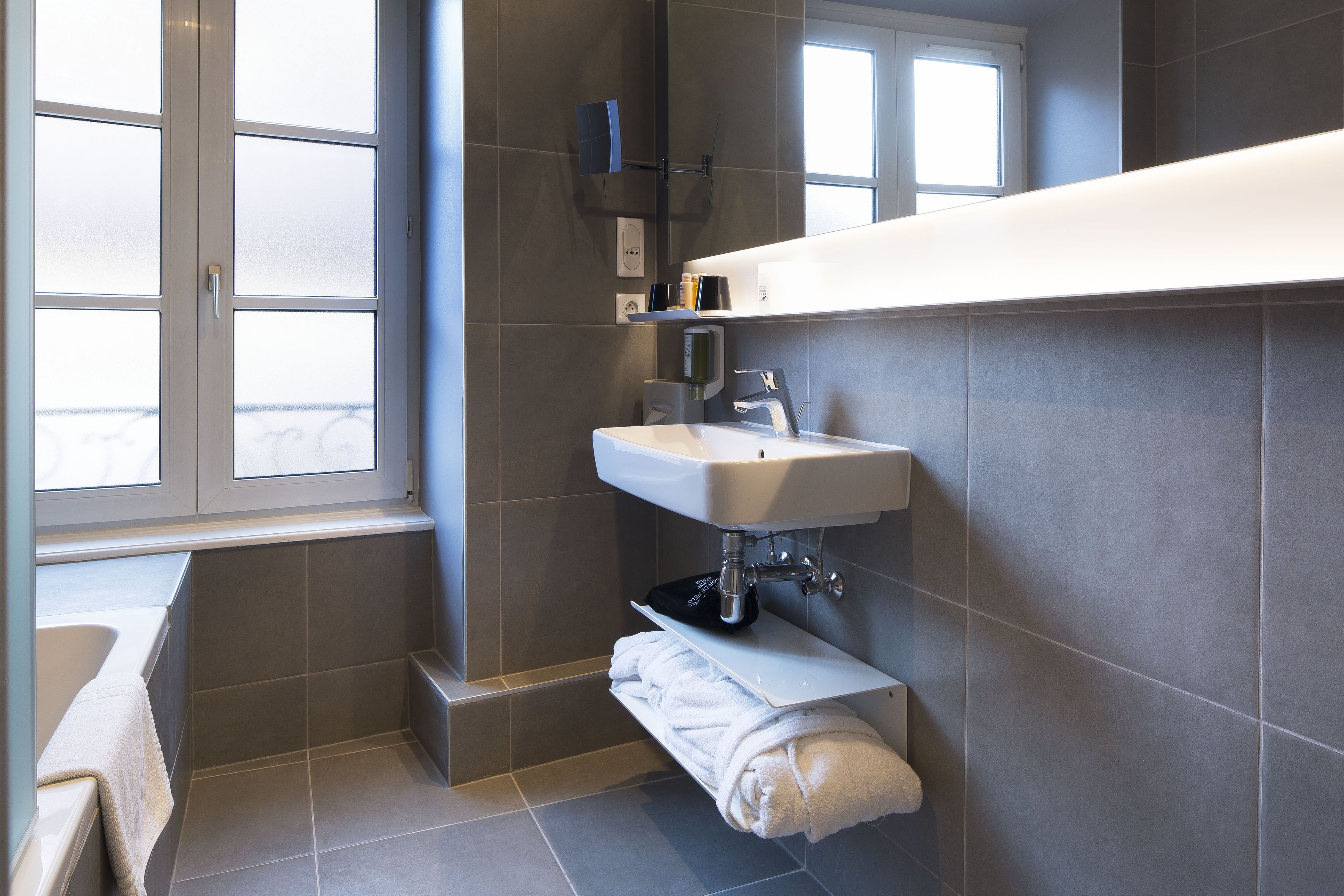 designer toiletries, hair dryer, bathrobes, slippers