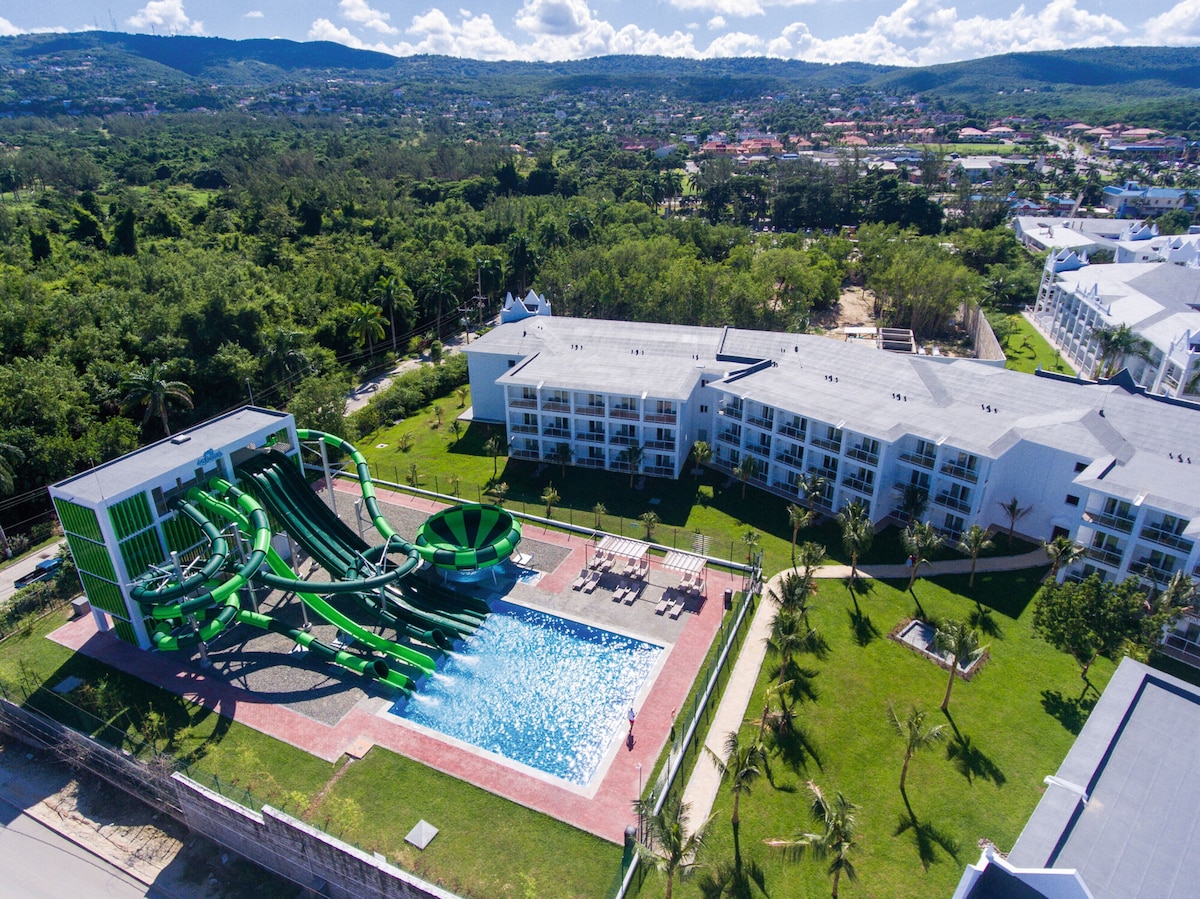 Relax by the pool or enjoy thrilling slides in our resort's water park, surrounded by lush greenery and scenic views.