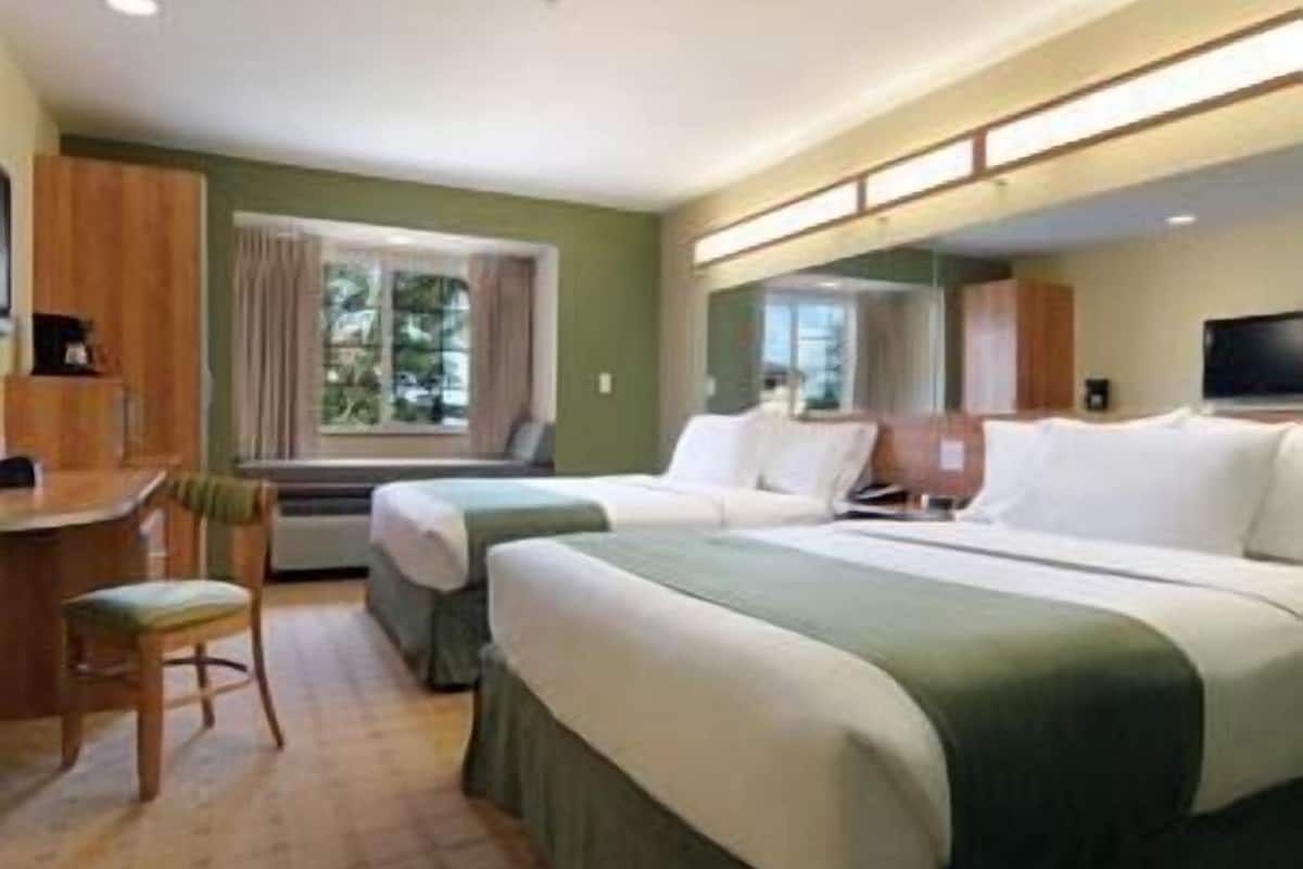 premium bedding, pillow-top beds, desk, blackout curtains