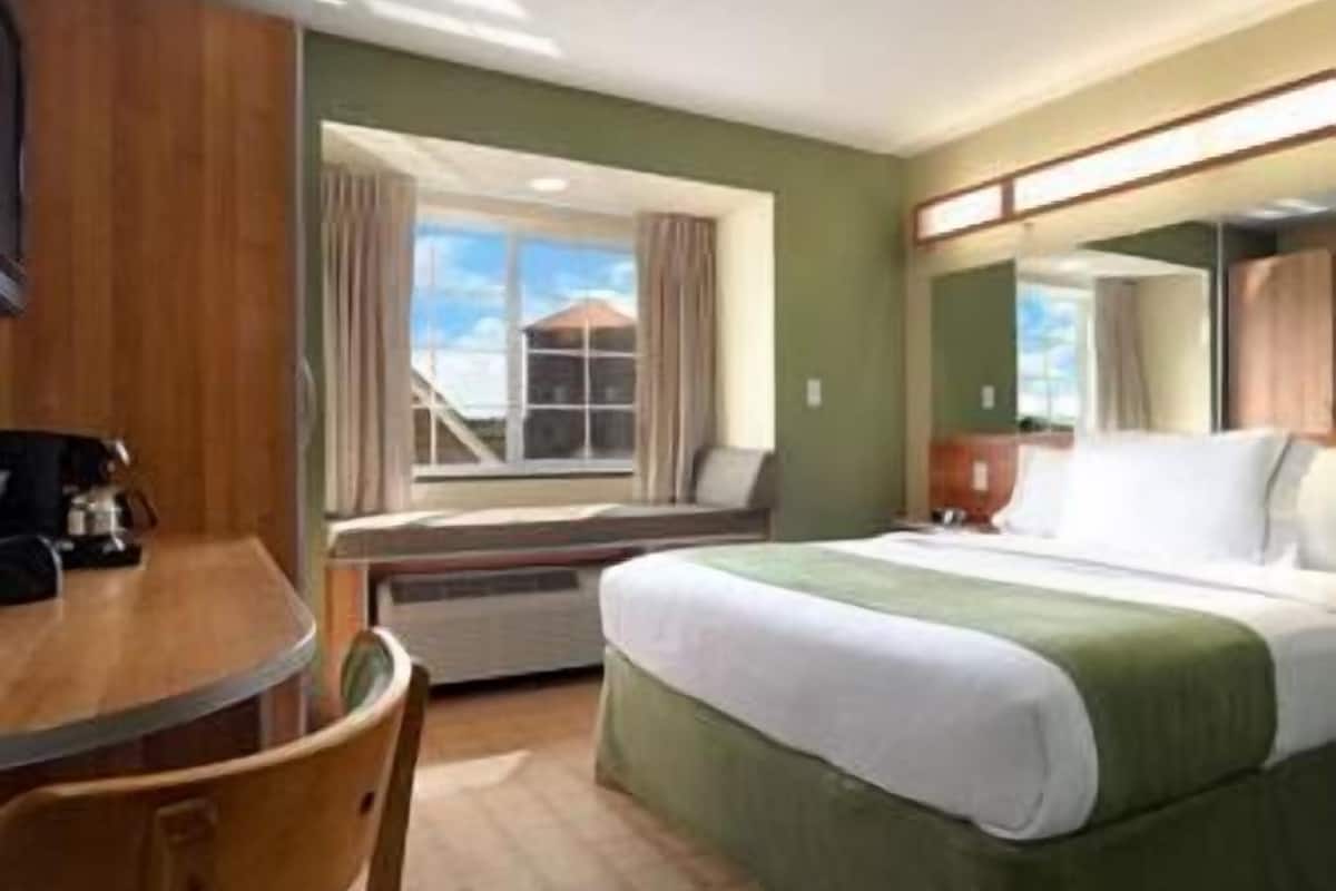 premium bedding, pillow-top beds, desk, blackout curtains