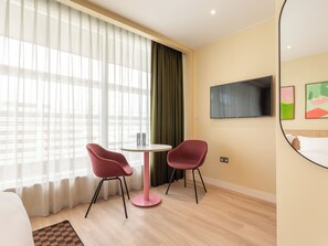 Large Studio with Kitchenette | Living area | 43-inch Smart TV with satellite channels