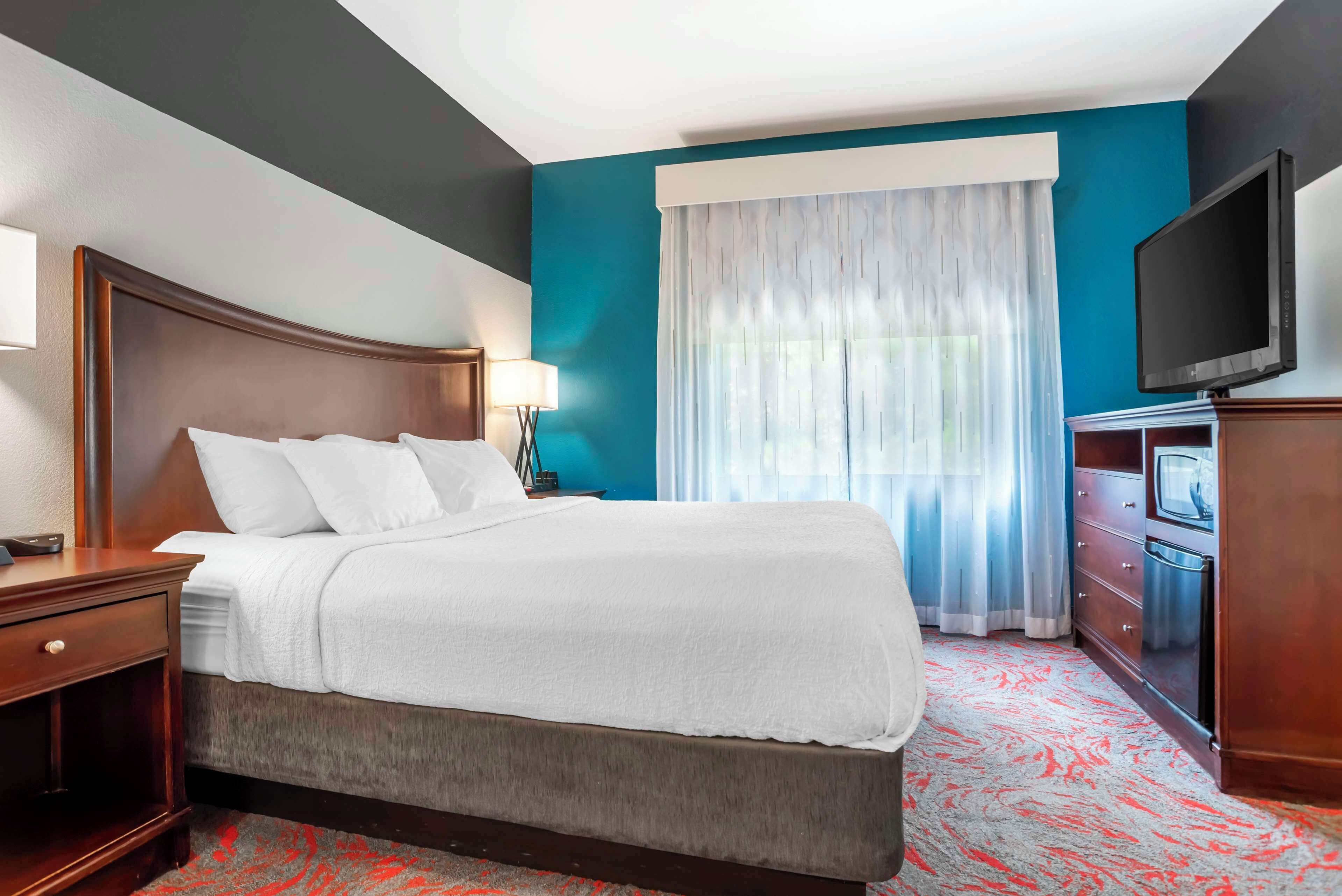 desk, laptop workspace, blackout curtains, iron/ironing board