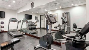 A gym with treadmills, a stationary bike, and weightlifting equipment. - Best Western Plus Daphne Inn & Suites (Daphne)