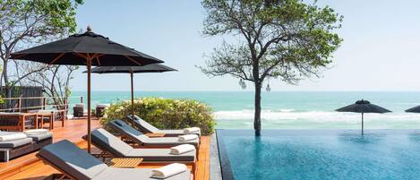 Outdoor pool, pool umbrellas, sun loungers