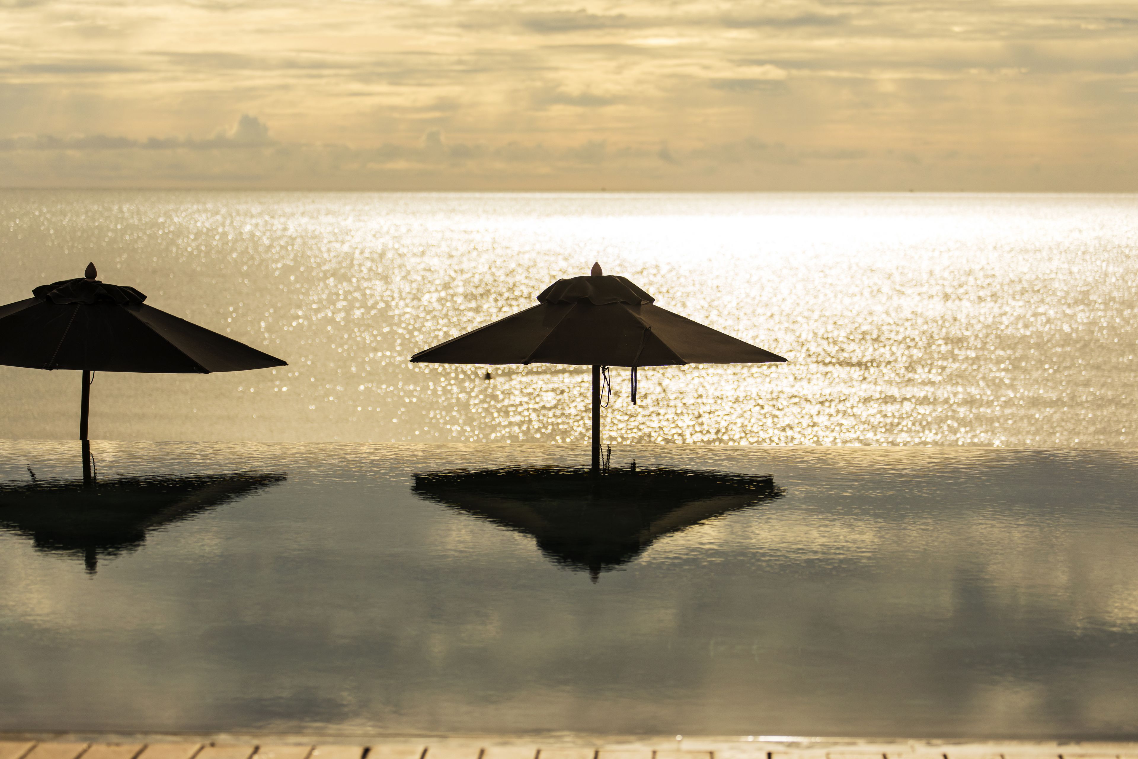 on the beach, sun-loungers, beach umbrellas, beach towels
