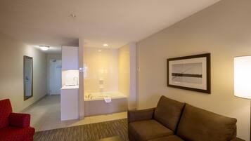 Suite, 1 King Bed, Jetted Tub | Hypo-allergenic bedding, in-room safe, desk, blackout curtains