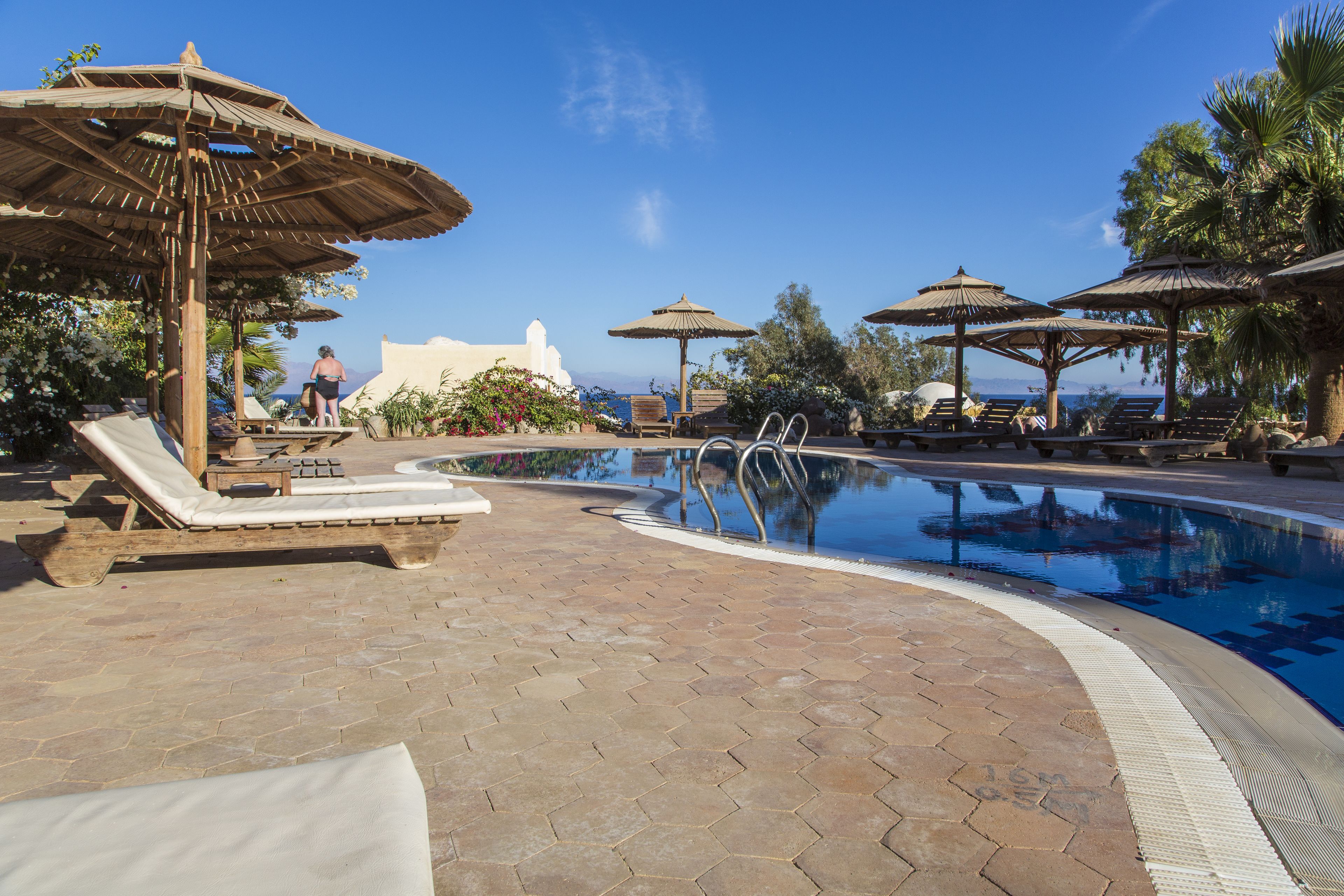 outdoor pool, pool umbrellas, pool loungers