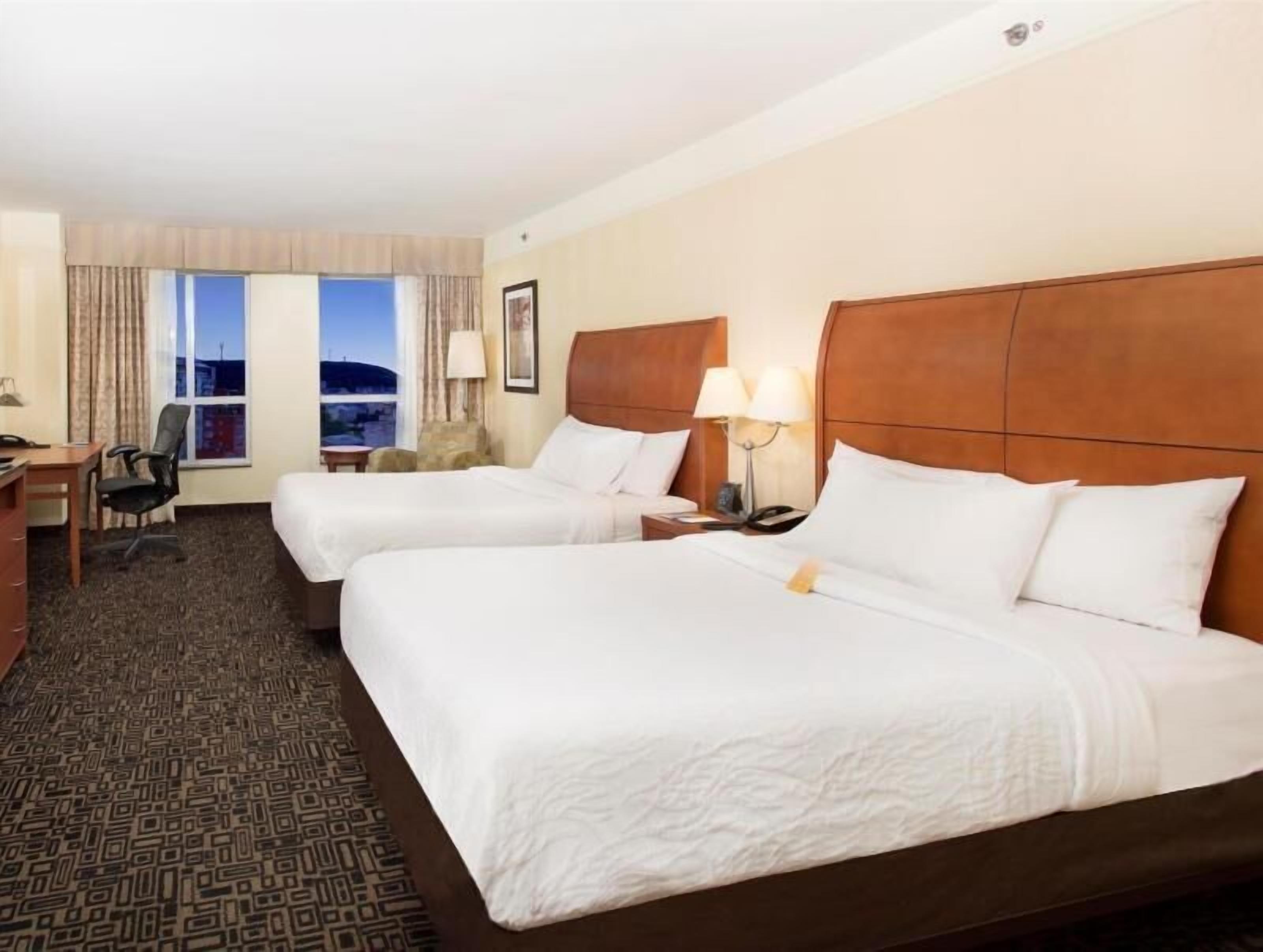 Premium bedding, in-room safe, laptop workspace, soundproofing