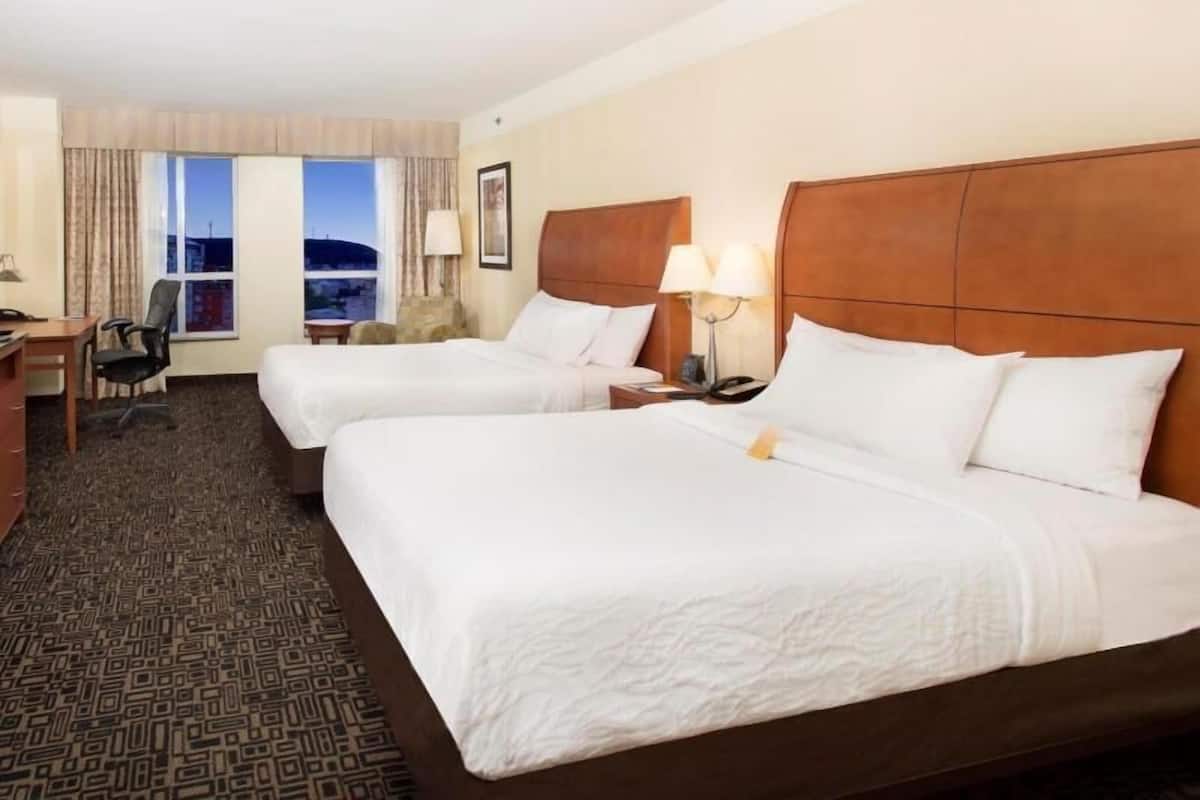 Premium bedding, in-room safe, laptop workspace, soundproofing